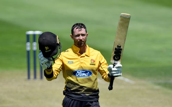 Firebirds Devon Conway celebrates 100 runs.