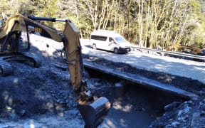The Muddy Creek convoy underway at midday on Tuesday with work underway in the creek and temporary earth bund on the bridge where there is no barrier.
