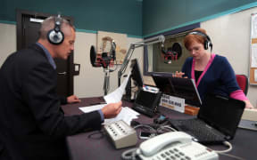 260314. Photo Diego Opatowski / RNZ. Guyon Espiner and Susie Ferguson at the Morning Report studio, Radio NZ.