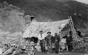 Chinese gold miners outside a dwelling in Macetown