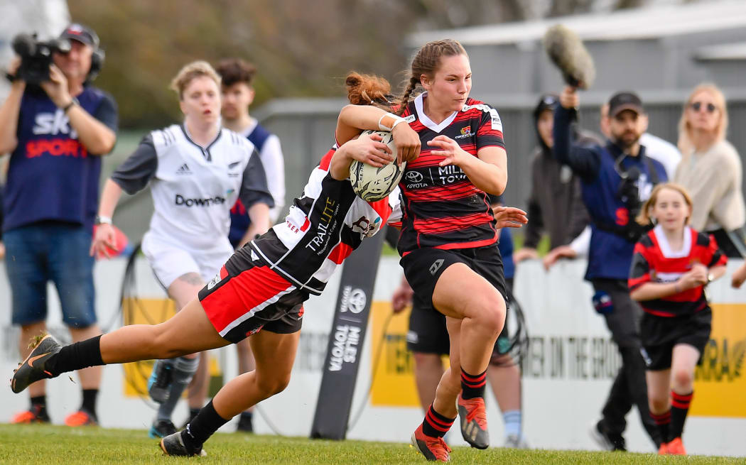 Bronwyn Dibb of Canterbury is tackled by Shonte To'a of Counties Manukau.