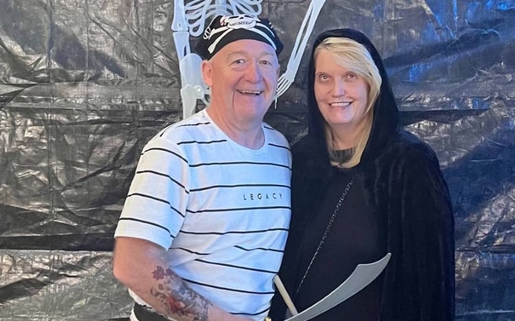 Geoffrey and Karen Boucher pictured at a Halloween work event in 2021.