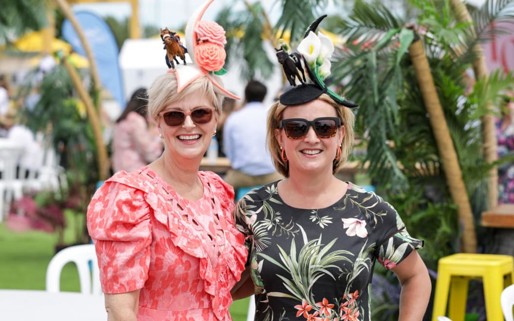 Steph McGreavy (left) and Kit Winter-Davies from Timaru decked out with handmade felt fascinators for IRT New Zealand Trotting Cup Day in Christchurch.