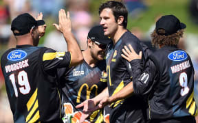 The Firebirds congratulate Hamish Bennett who took three wickets.