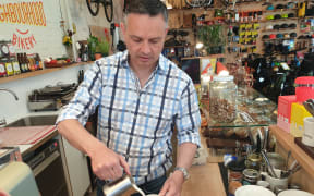 Green Party co-leader James Shaw shows off his barista experience while campaigning on 16 October, 2020.