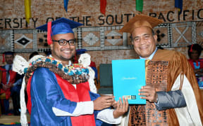PhD in Climate Change graduate, Jale Samuwai, is conferred with the award by the H.E Taneti Maamau, Chancellor of USP