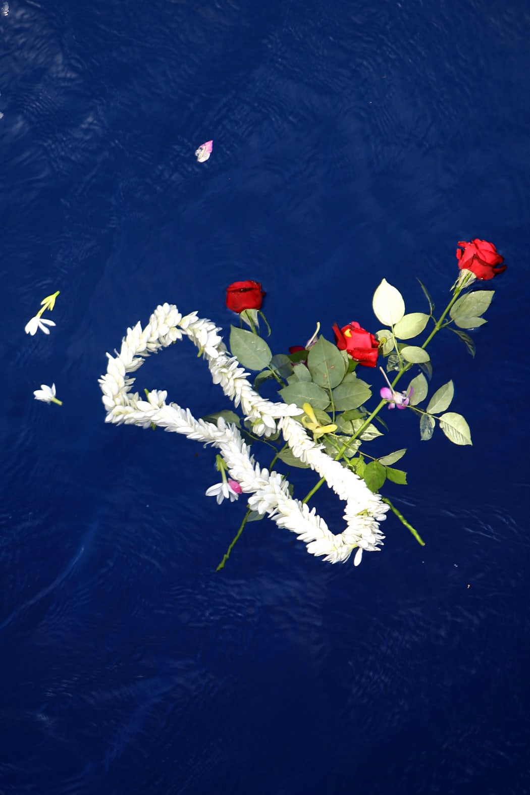 Flowers are left at Air Moorea crash site