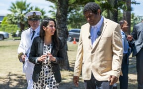 France's Minister for Overseas Naima Moutchou (L) is welcomed by the Customary Senate President Ludovic Boula (R) in Noumea, in the French overseas collectivity of New Caledonia, on November 10, 2025. (Photo by Delphine MAYEUR / AFP)