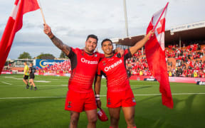 Andrew Fifita, (left) and Tevita Pangai Junior celebrate a win during the 2017 World Cup