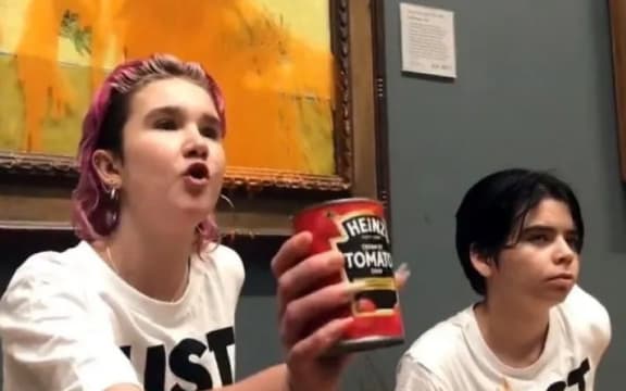 Activists from Just Stop Oil throw tomato soup over Vincent van Gogh's 'Sunflowers' at the National Gallery in London.