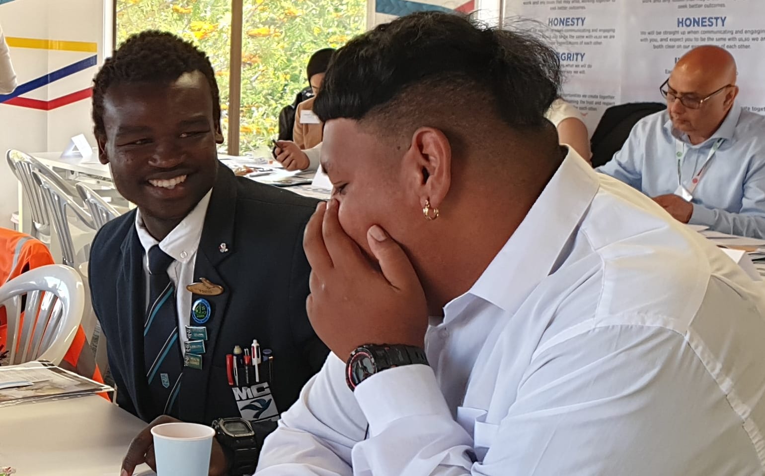 	Māngere College graduate Younis Ahamt Abdallah (in dark blue suit).