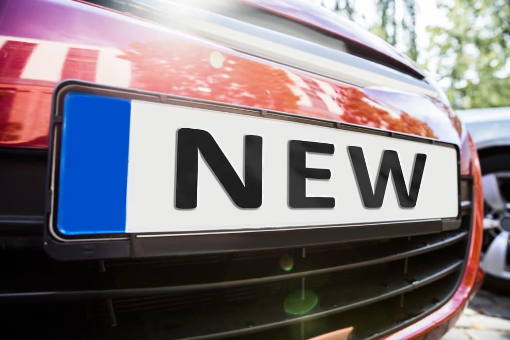 Close-up Of The License Plate Showing New Word On The Car