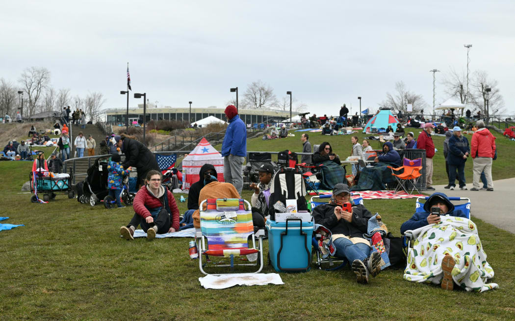 People are set up at Niagara Falls State Park ahead of a total solar eclipse across North America, in Niagara Falls, New York, on April 8, 2024. This year's path of totality is 115 miles (185 kilometers) wide and home to nearly 32 million Americans, with an additional 150 million living less than 200 miles from the strip. The next total solar eclipse that can be seen from a large part of North America won't come around until 2044. (Photo by ANGELA WEISS / AFP)