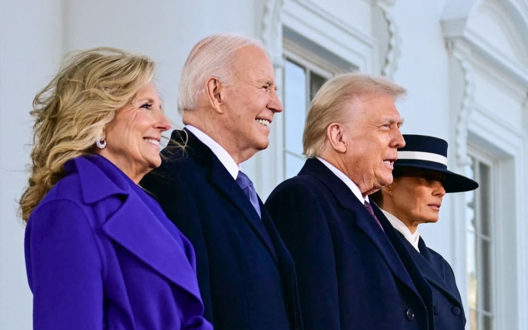 US President Joe Biden and First Lady Jill Biden greet President-elect Donald Trump and Melania Trump as they arrive at the White House in Washington, DC, on January 20, 2025, before departing for the US Capitol where Trump will be sworn in as the 47th US President.
