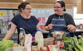 Waitara Pataka Kai manager Amy Olsen with student solo mum of two Nikita Dravitski.