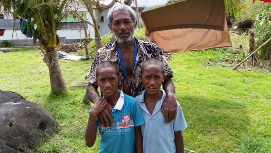 Iosefo and his twin sons in Fiji's Lavena village