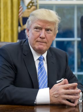 United States President Donald Trump prepares to sign three Executive Orders on 23 January, including one concerning the withdrawal of the Trans-Pacific Partnership (TPP).