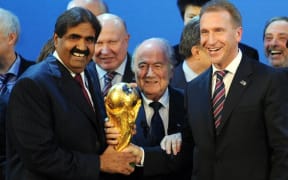 Sheikh Hamad bin Khalifa Al-Thani of Qatar, left, Fifa president Joseph Blatter and Russia's Deputy Prime Minister Igor Shuvalov celebrate the winning bids in 2010.