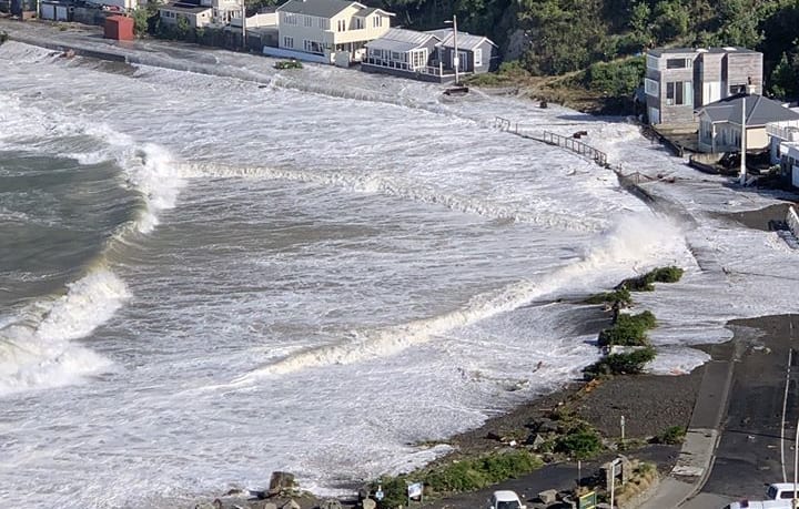 Massive waves wash over Ōwhiro Bay.