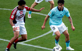Auckland FC's Emiliano Tade (Right) takes on Tahiti United's Bradley Ruiz in Melbourne. 27 February 2026