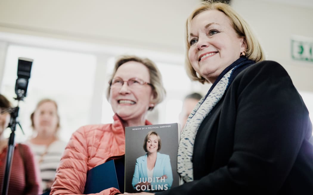 Judith Collins with her book in Wellington