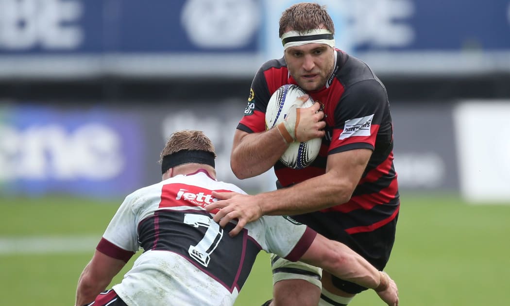 Canterbury player Luke Whitlock is tackled by North Harbour's Josh Blucher, 2015.
