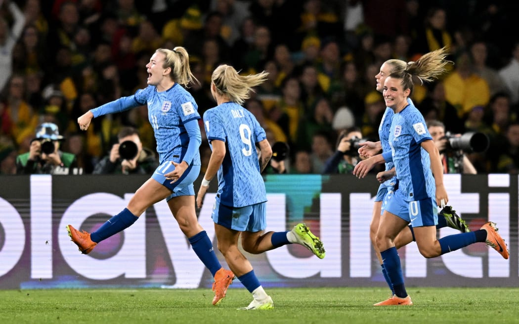 England's forward Lauren Hemp (L) celebrates scoring her team's second goal during the Australia and New Zealand 2023 Women's World Cup semi-final football match between Australia and England.