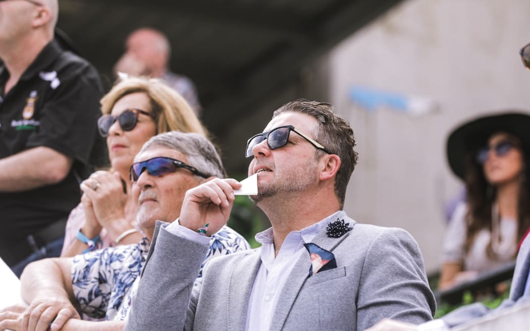 Crowds excited for New Zealand Trotting Cup at Addington Raceway in Christchurch.