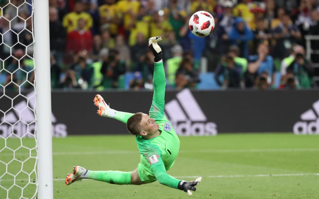 England goalkeeper Jordan Pickford stops Colombia's Carlos Bacca's kick in a penalty shootout.