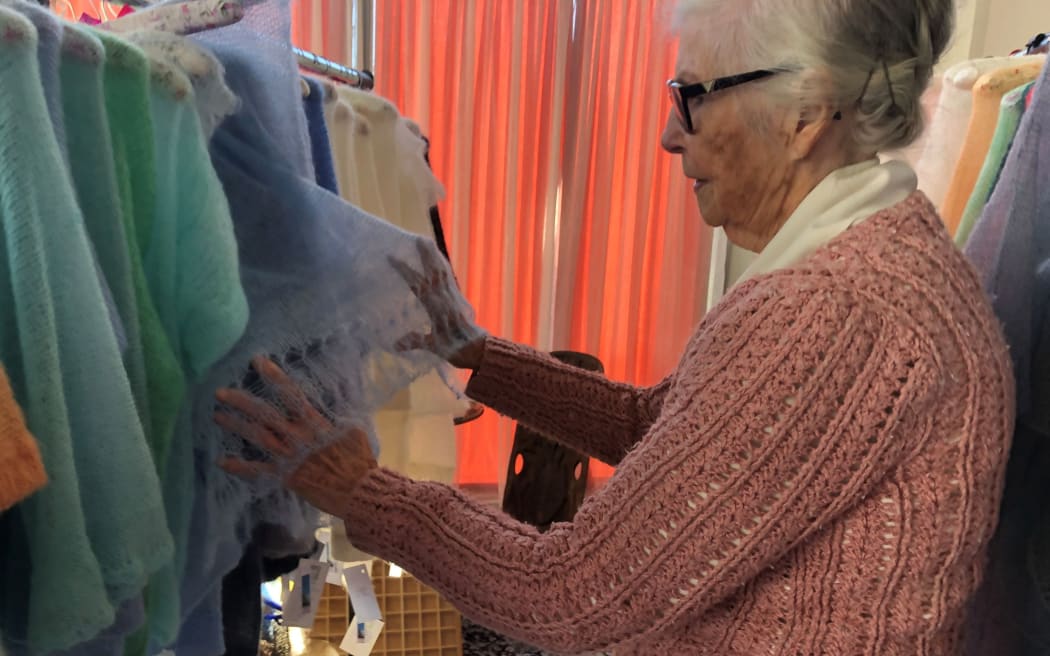 Margaret Richardson shows off one of her garments.