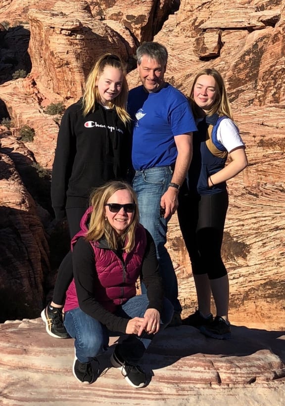 Lucie Ozanne (crouching) with her family