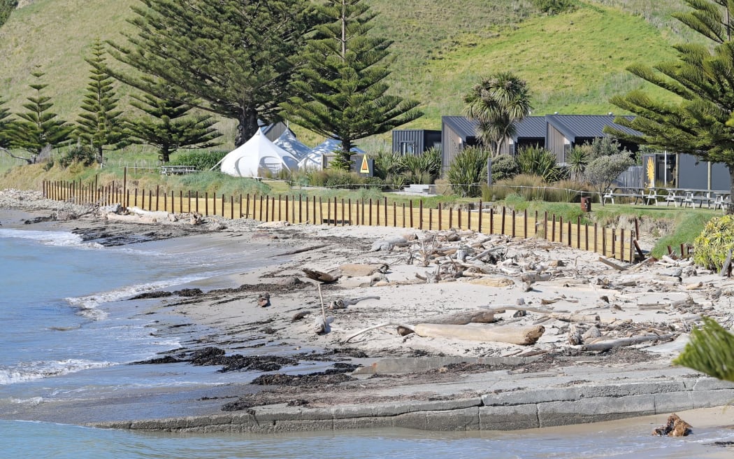 Former Gisborne mayor Meng Foon has landed himself in hot water with the district council over an unconsented seawall he constructed in front of the campground he owns with his wife.