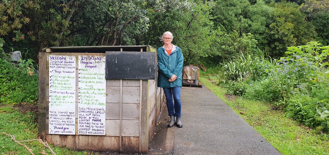 Volunteer and 'compost queen' Chris Montgomery stands next to the compost bins at Wellington's Innermost Gardens, which are popular with locals wanting to recycle food scraps.