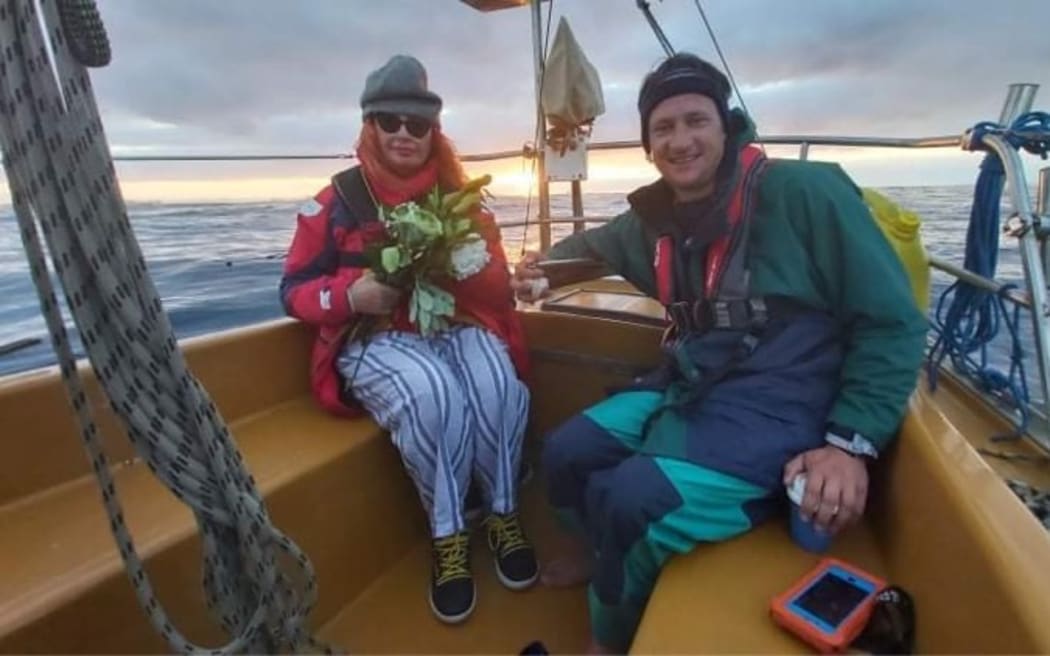 Hamish and Fiona Tarlton with flowers for Kelly in December 2020.
