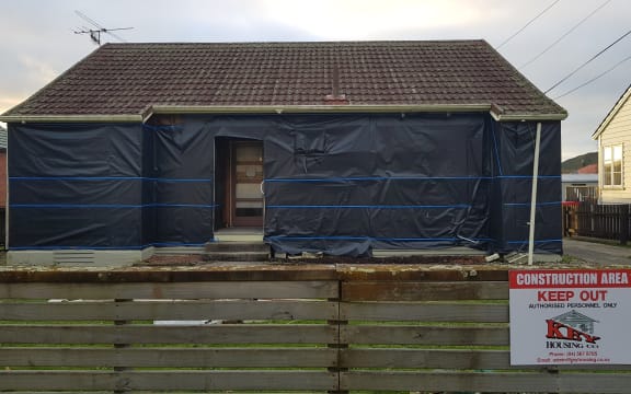 A state house in Naenae has had all exterior cladding removed.