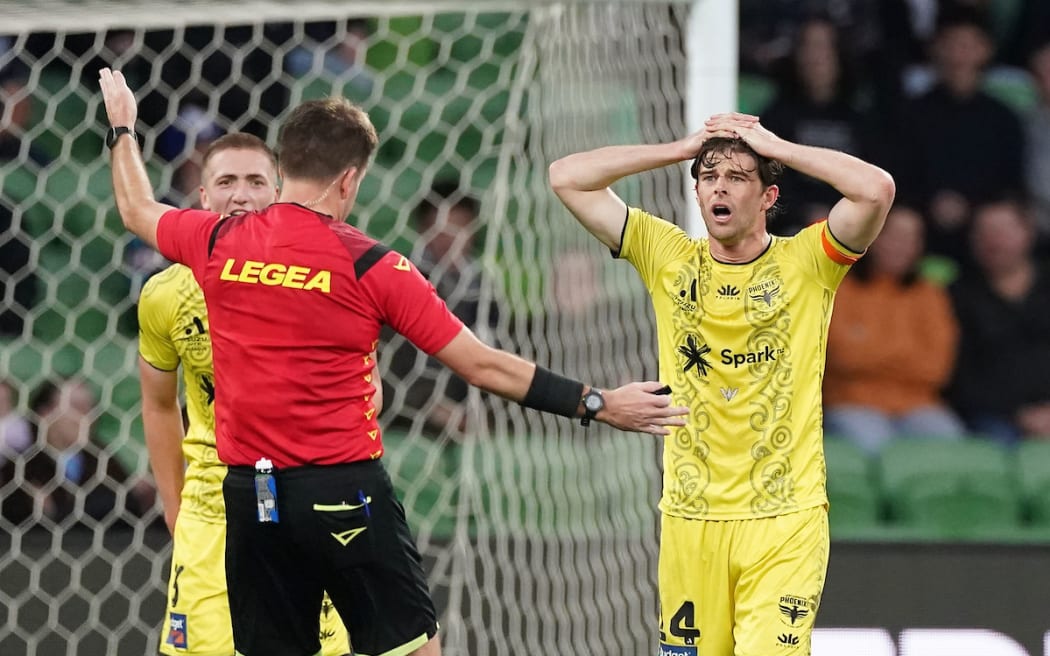 Alex Rufer of the Phoenix reacts towards referee Adam Kersey. Melbourne Victory FC v Wellington Phoenix FC, Isuzu Ute Men’s A-League semi final 1 at AAMI Park, Melbourne, Australia on Sunday 12 May 2024.