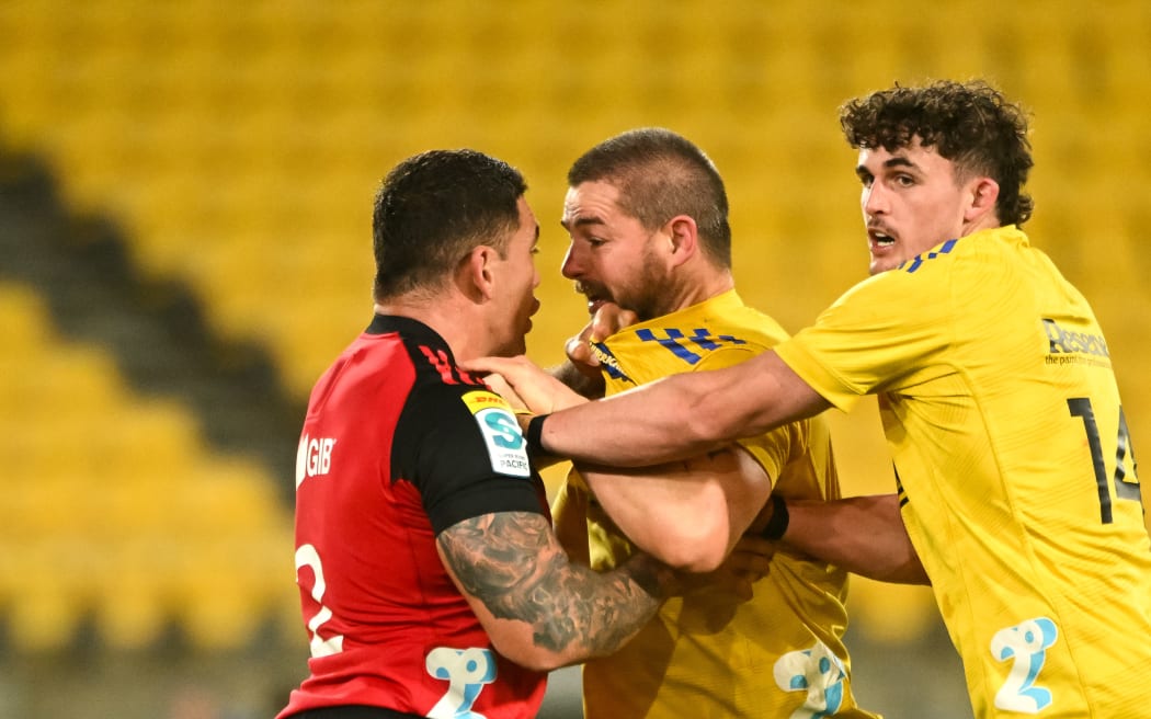 Codie Taylor of the Crusaders and Dane Coles of the Hurricanes square off in the Hurricanes v Crusaders match.
