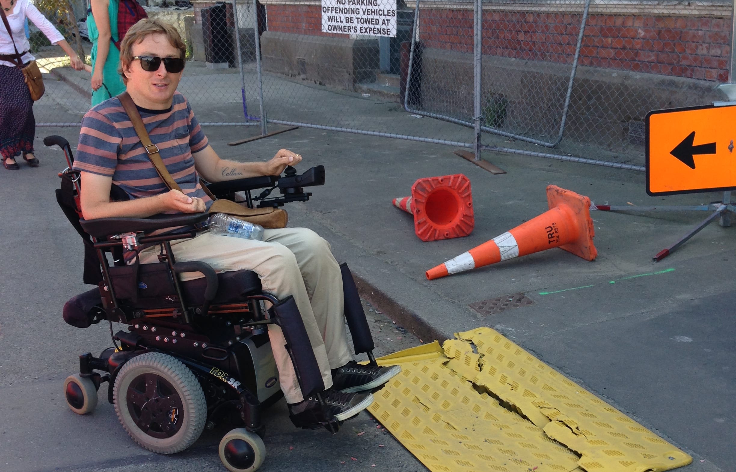 Johnny Bourke in the city centre next to a broken access ramp, which is an access barrier (picture taken this year).