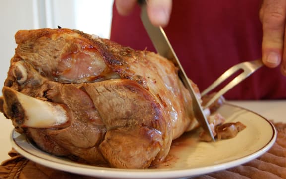roast lamb being carved