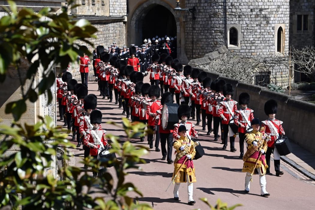 Members of a military band march into position at Windsor Castle in Windsor.