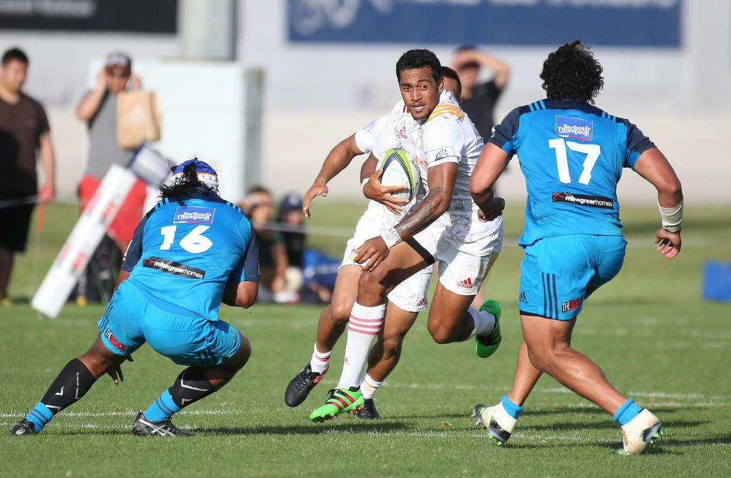 Chiefs player Latu Vaeno tries to slip between Blues players Hame Faiva, left, and Alex Hodgman during the Blues vs Chiefs pre season Super Rugby match played at Alexandra Park in Auckland on the 17th February 2017.