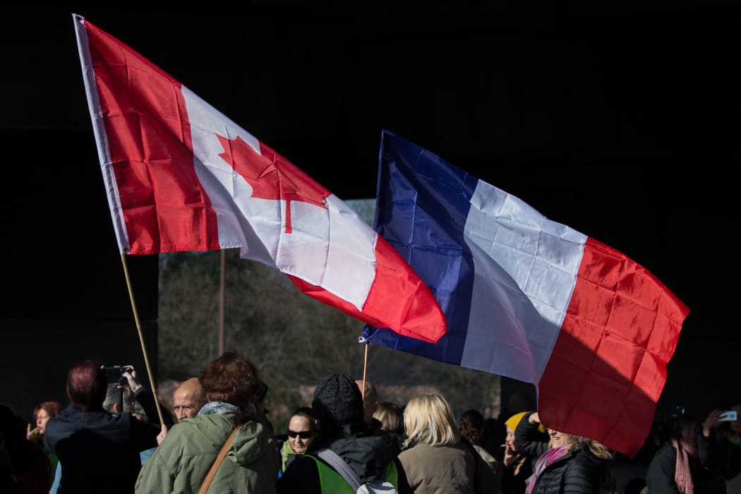 People in Toulouse, France, gather to support the protest convoy driving to Paris, 10 February.