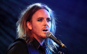 Comedian Tim Minchin with microphone