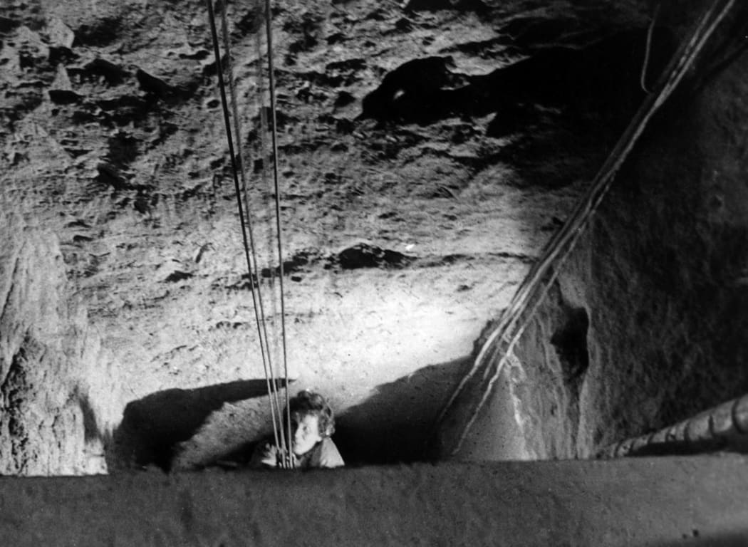 A woman is pulled out of an exit shaft on 5 October 1964 in Berlin. The shaft is part of an escape tunnel from East to West Berlin. 57 people escaped through this tunnel until it was detected on the East Berlin side.
