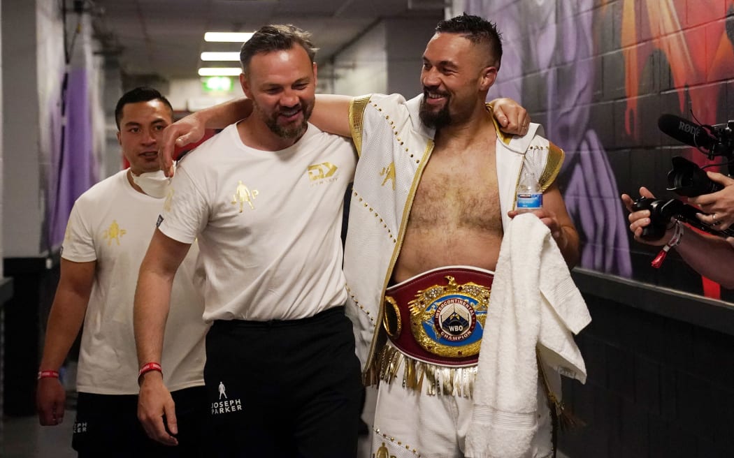 Joseph Parker celebrates his win over Dereck Chisora with new trainer Andy Lee.