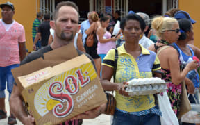 Residents buy groceries ahead of the arrival of Hurricane Matthew in Holguin province, Cuba on October 2, 2016.