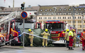 Rescue personnel cordoned off the area at the Turku Market Square where several people were stabbed.