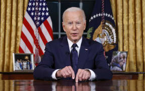 US President Joe Biden addresses the nation on the conflict between Israel and Gaza and the Russian invasion of Ukraine from the Oval Office of the White House in Washington, DC, on October 19, 2023. President Joe Biden will deliver a rare Oval Office speech October 19, 2023 urging Americans to back military aid for Israel and Ukraine at what he calls a perilous moment for democracy around the globe. (Photo by JONATHAN ERNST / POOL / AFP)