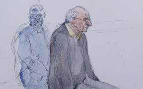 (FILES) This court sketch created on May 23, 2025, shows the defendant, French retired surgeon Joel Le Scouarnec listening during a hearing in his trial on charges of rape and sexual assault of 299 former patients, at the courthouse of Vannes, western france, on May 23, 2025. A French court on May 28, 2025 gave the maximum 20-year jail term to a surgeon who admitted sexually abusing hundreds of patients, most of them children, during more than two decades. (Photo by Benoit PEYRUCQ / AFP)