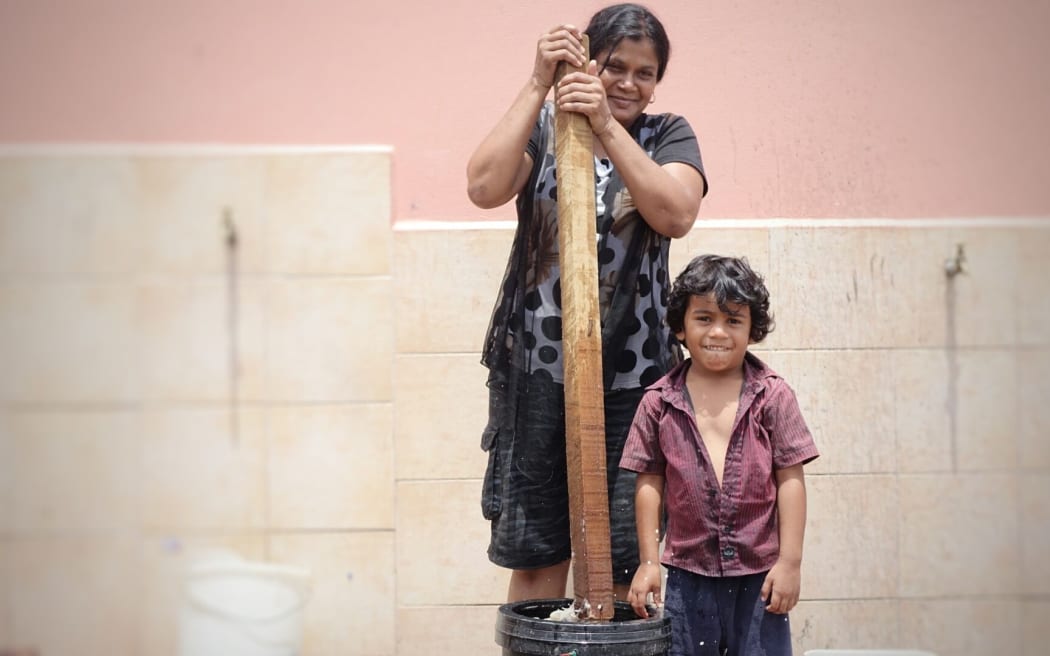 Yogeshni Lata hand-washes her family's clothes while she can